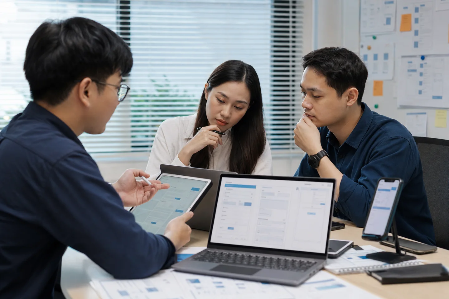 Quality engineering team testing software across multiple devices